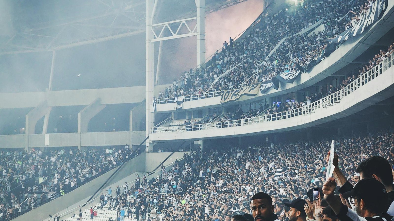 Soccer fans cheering in the stands