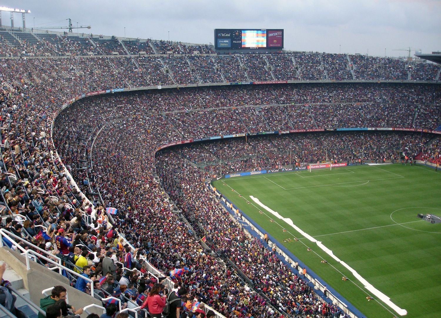 Packed soccer stadium with cheering fans
